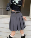 A classic pleated skirt featuring a high waist and knee-length design