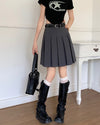 A classic pleated skirt featuring a high waist and knee-length design