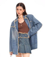 A distressed denim blazer featuring a charming butterfly pin and frayed edges. This jacket includes large front pockets and a lapel collar, perfect for adding a vintage and grunge touch to any outfit