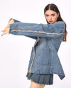 A distressed denim blazer featuring a charming butterfly pin and frayed edges. This jacket includes large front pockets and a lapel collar, perfect for adding a vintage and grunge touch to any outfit