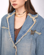 A distressed denim blazer featuring a charming butterfly pin and frayed edges. This jacket includes large front pockets and a lapel collar, perfect for adding a vintage and grunge touch to any outfit