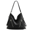 Aesthetic shoulder bag in black with a sleek design and front zipper &amp; stars detail - boogzel clothing