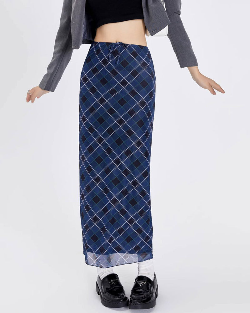 A stylish blue plaid maxi skirt with a high-waist design and drawstring closure. The skirt features a checkered pattern in varying shades of blue, creating a modern yet classic look. Its long, straight silhouette provides a sleek and elegant appearance, perfect for both casual and semi-formal occasions