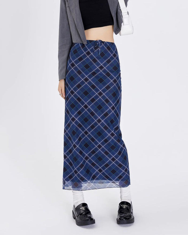 A stylish blue plaid maxi skirt with a high-waist design and drawstring closure. The skirt features a checkered pattern in varying shades of blue, creating a modern yet classic look. Its long, straight silhouette provides a sleek and elegant appearance, perfect for both casual and semi-formal occasions