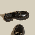 Black leather preppy loafers featuring a chunky sole and a gleaming silver chain across the vamp -  boogzel clothing