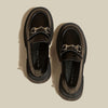 Black leather preppy loafers featuring a chunky sole and a gleaming silver chain across the vamp -  boogzel clothing