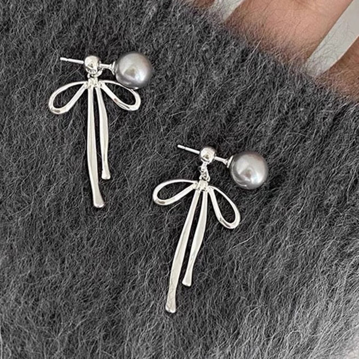 bow pendant pearl earrings boogzel clothing