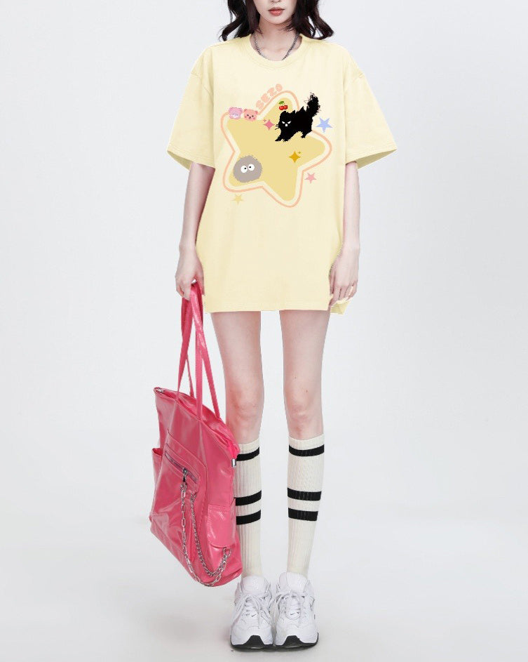 Casual oversized yellow t-shirt featuring a playful cartoon black cat and star print - Boogzel Clothing