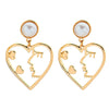 face outline heart earrings
