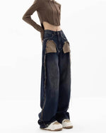 These Canyon Town Cowboy Jeans have a wide-leg cut, large contrasting front pockets, and frayed side details