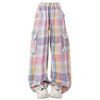 Soft girl aesthetic cargo pants in pastel plaid. Designed with an oversized fit and multiple pockets