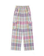 Soft girl aesthetic cargo pants in pastel plaid. Designed with an oversized fit and multiple pockets