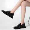 The Futuristic Platform Loafers feature a sleek black design with a high platform sole - Boogzel Clothing