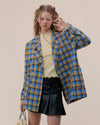 The Oversized Preppy-Style Plaid Blazer features a vibrant blue and yellow plaid pattern. Its double-breasted style and roomy fit make it ideal for layering over any look