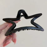 This 90's style hair clip is designed with a sturdy grip and a cute star shape - boogzel clothing