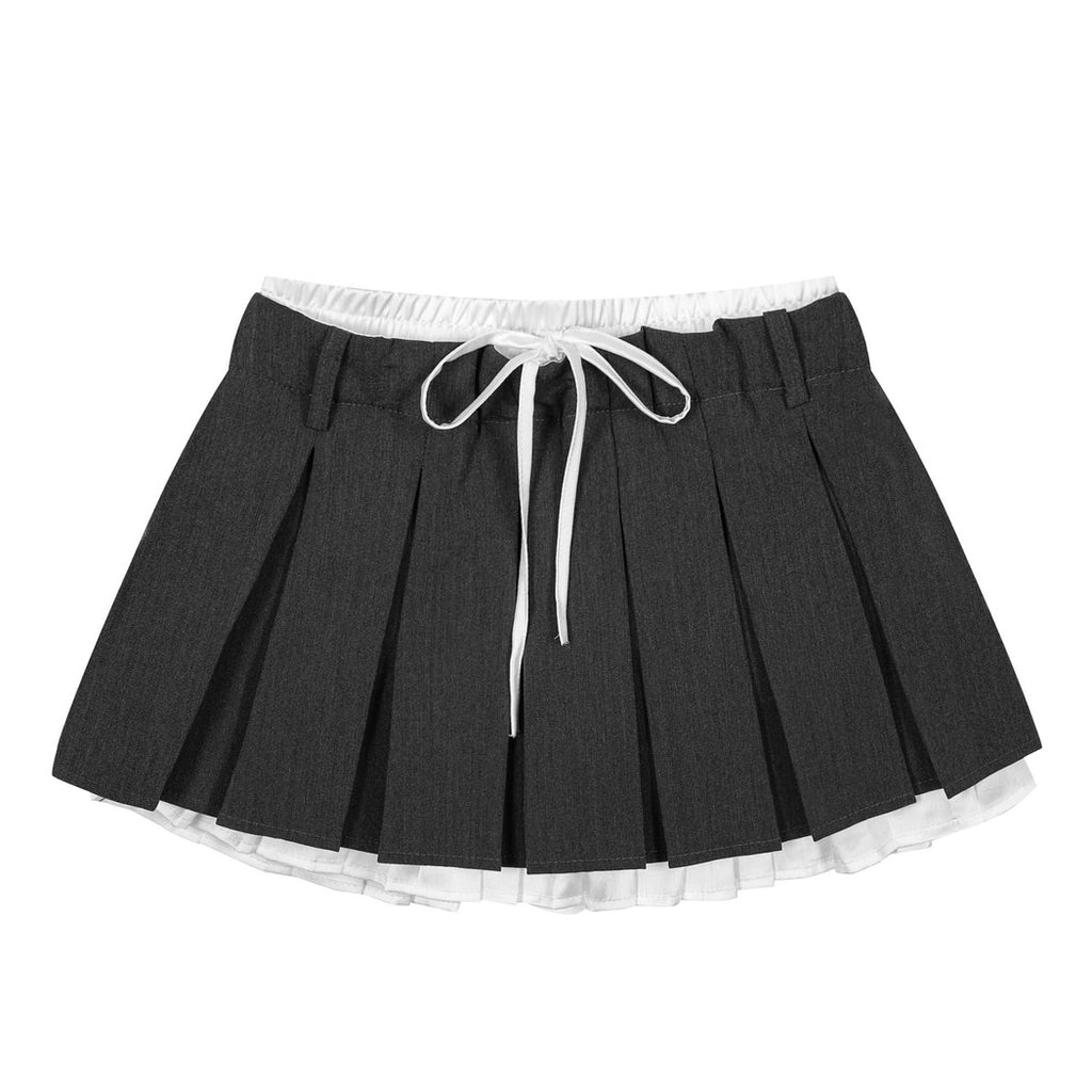 This layered preppy skirt features pleated detailing with a contrast lace underskirt. The ribbon waist and layered construction give it a playful, school-girl vibe- boogzel clothing