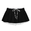 This layered preppy skirt features pleated detailing with a contrast lace underskirt. The ribbon waist and layered construction give it a playful, school-girl vibe- boogzel clothing