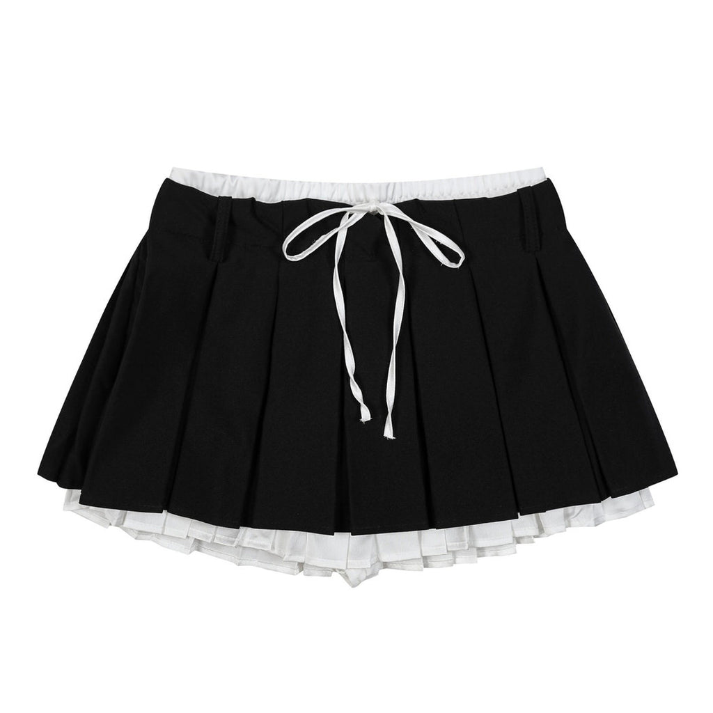 This layered preppy skirt features pleated detailing with a contrast lace underskirt. The ribbon waist and layered construction give it a playful, school-girl vibe- boogzel clothing