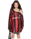 This oversized jersey features a striped pattern, off-shoulder cut, and "Blokette" text across the front - boogzel clothing