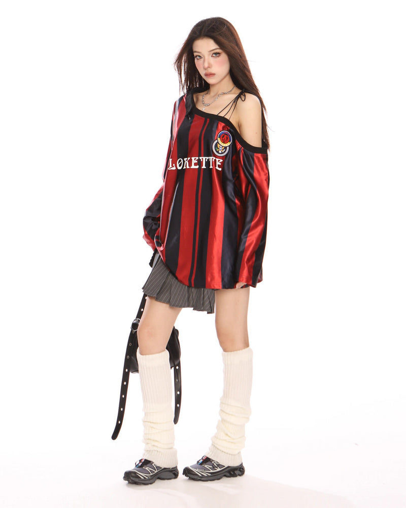 This oversized jersey features a striped pattern, off-shoulder cut, and "Blokette" text across the front - boogzel clothing