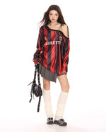 This oversized jersey features a striped pattern, off-shoulder cut, and "Blokette" text across the front - boogzel clothing