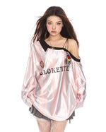 This oversized jersey features a striped pattern, off-shoulder cut, and "Blokette" text across the front - boogzel clothing