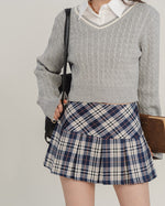 This preppy aesthetic mini skirt features a high waist, pleated design and classic plaid pattern - boogzel clothing