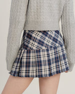 This preppy aesthetic mini skirt features a high waist, pleated design and classic plaid pattern - boogzel clothing