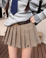 This preppy aesthetic mini skirt features plaid fabric with a pleated construction, complete with a matching faux leather belt - boogzel clothing