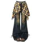 Wide-leg flared jeans with a distressed finish, featuring a yellow plaid shirt-tie detail around the waist - boogzel clothing