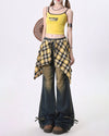 Wide-leg flared jeans with a distressed finish, featuring a yellow plaid shirt-tie detail around the waist - boogzel clothing