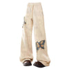 These baggy trousers feature embroidered butterfly patches and a relaxed fit - boogzel clothing