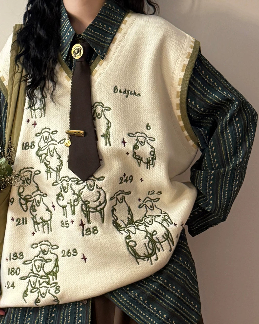 green_sweater_vest_with_tie_and_collared_shirt_preppy_outfit