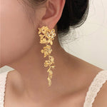 golden blossom drop earrings boogzel clothing