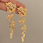 golden blossom drop earrings boogzel clothing