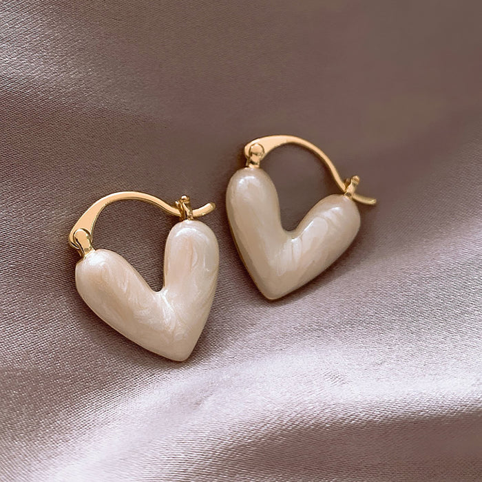 heart pearl earrings boogzel clothing