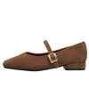 This aesthetic Mary Jane shoe featuring a square toe, low block heel, and soft suede-like surface. Designed with a slim strap and shiny gold buckle