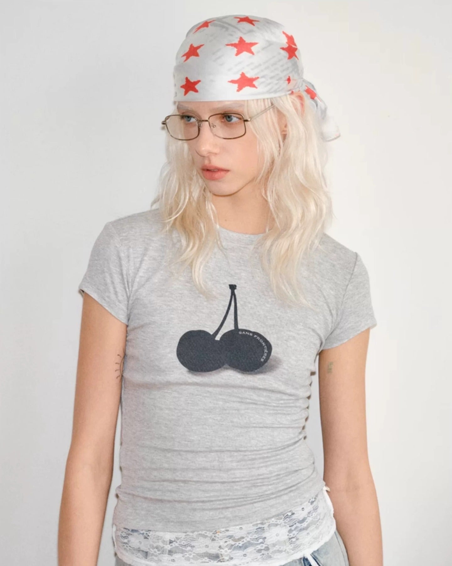 model_wearing_red_star_bandana_tied_as_head_scarf
