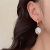 moon and star pearl earrings boogzel clothing