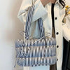 puffer striped shoulder bag boogzel clothing