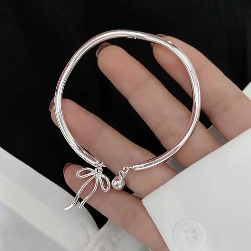 silver bow bracelet boogzel clothing