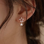 star asymmetric earrings boogzel clothing