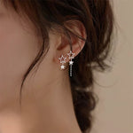 star asymmetric earrings boogzel clothing